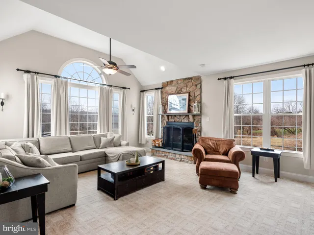 a living room with furniture and windows