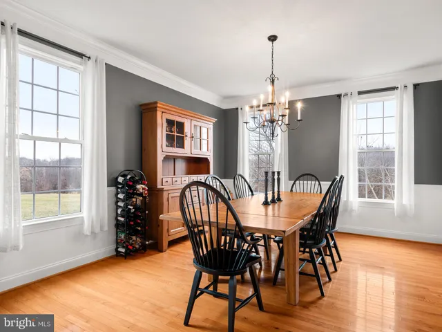 a view of walk in closet with clothes