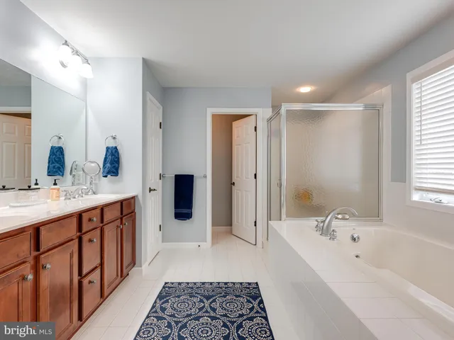 a spacious bedroom with a bed and window