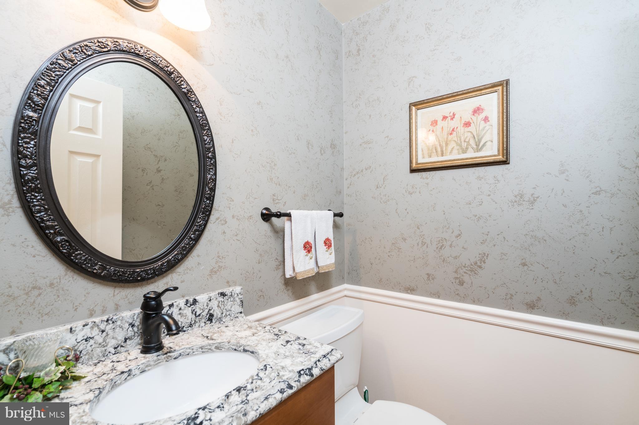 6951 Spaniel Road Springfield, VA 22153 - Photo 14 of 28 a bathroom with a granite countertop sink and a mirror
