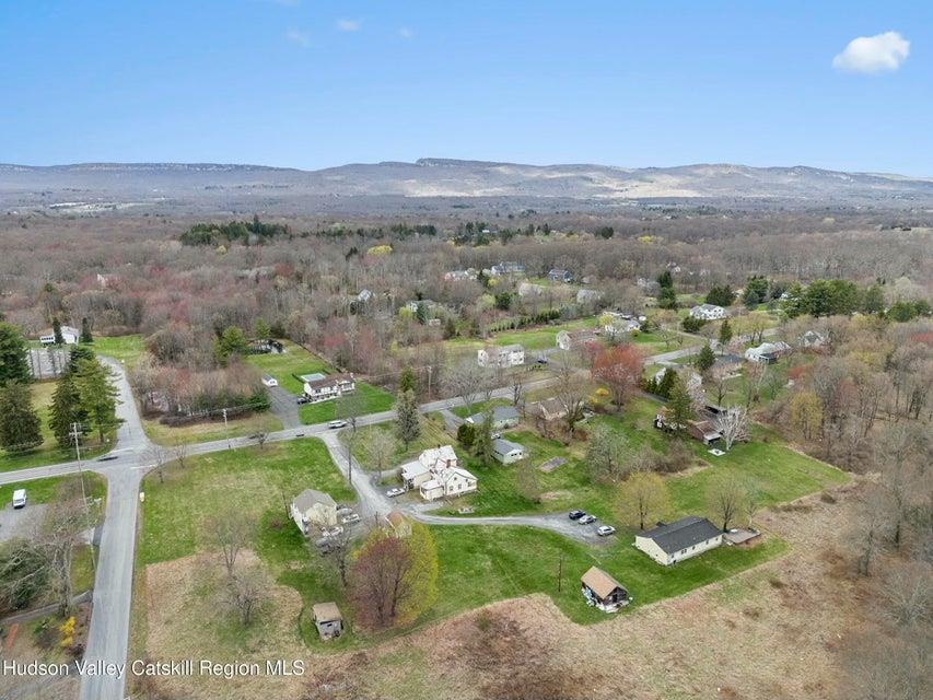 236 State Rte 32 South New Paltz, NY 12561 - Photo 2 of 11 an aerial view of green landscape with trees houses and mountain view