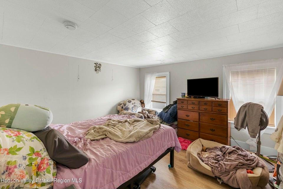 236 State Rte 32 South New Paltz, NY 12561 - Photo 5 of 11 a bedroom with a bed and wooden floor