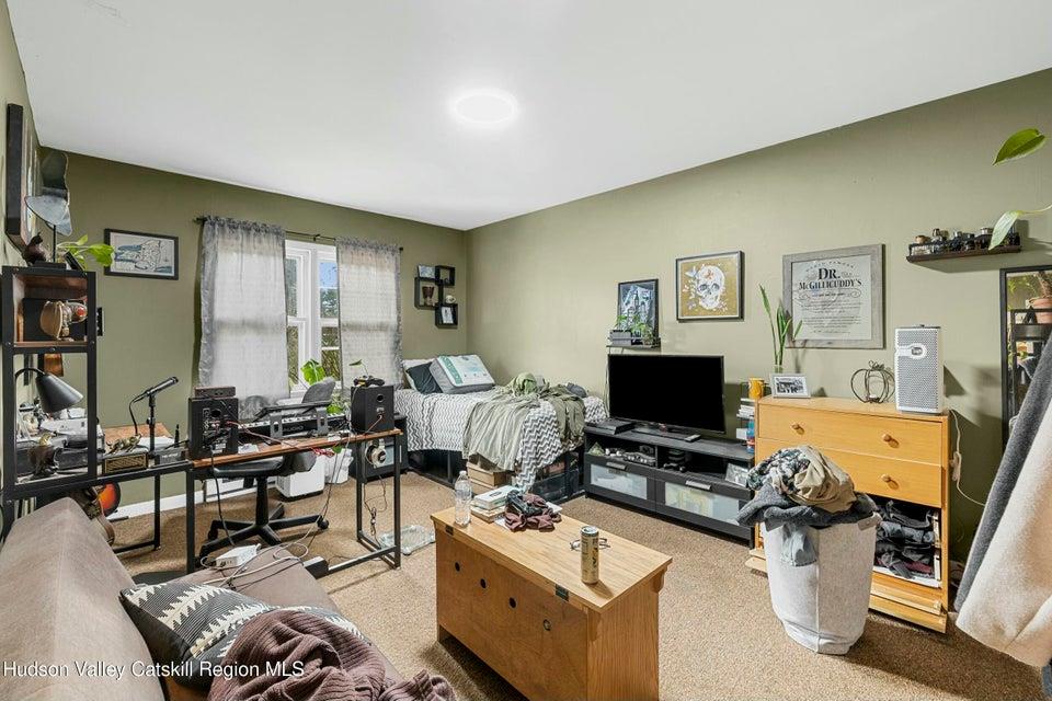 236 State Rte 32 South New Paltz, NY 12561 - Photo 10 of 11 a living room with furniture and a flat screen tv
