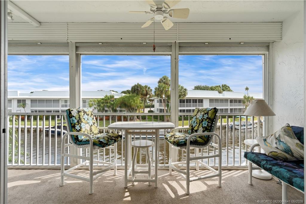 1866 Southwest Palm City Road, Unit 204 Stuart, FL 34994 - Photo 10 of 38 a view of a patio with a table and chairs