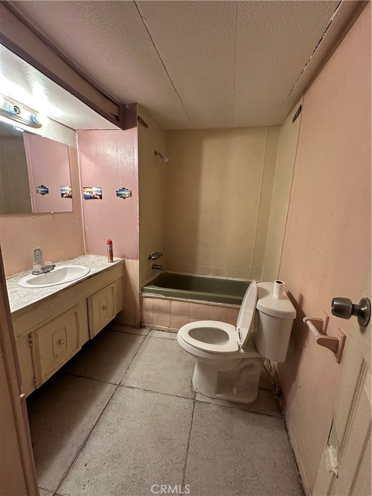 258 West 7th Street, Unit 51 San Jacinto, CA 92583 - Photo 11 of 14 a bathroom with a double vanity sink and mirror
