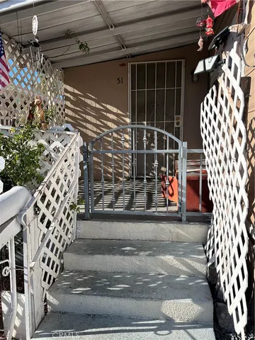 a view of a porch with wooden floor