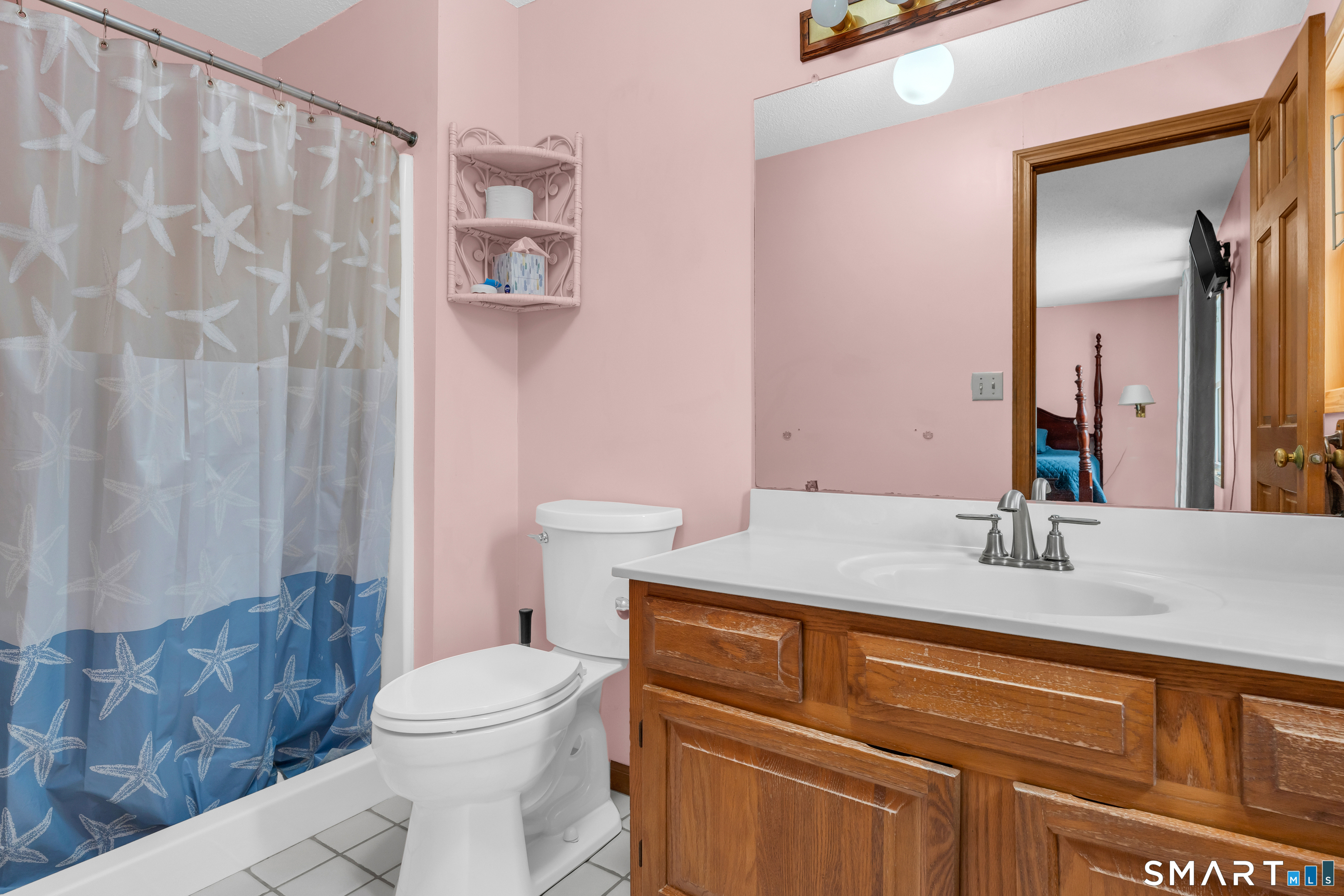 26 Pent Road Branford, CT 06405 - Photo 16 of 28 a bathroom with a sink a toilet and shower