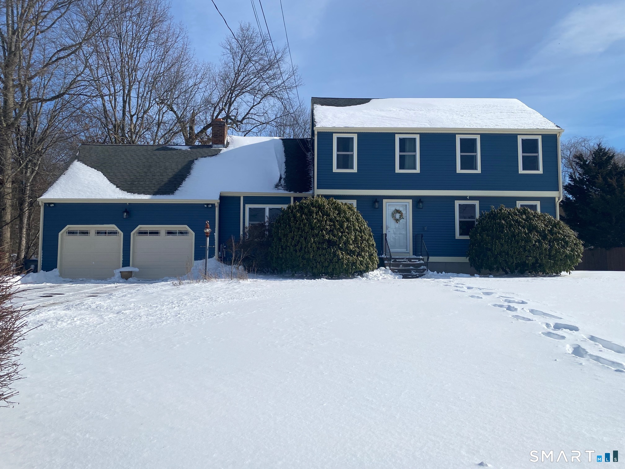 26 Pent Road Branford, CT 06405 - Photo 2 of 28 a front view of a house with a yard and garage