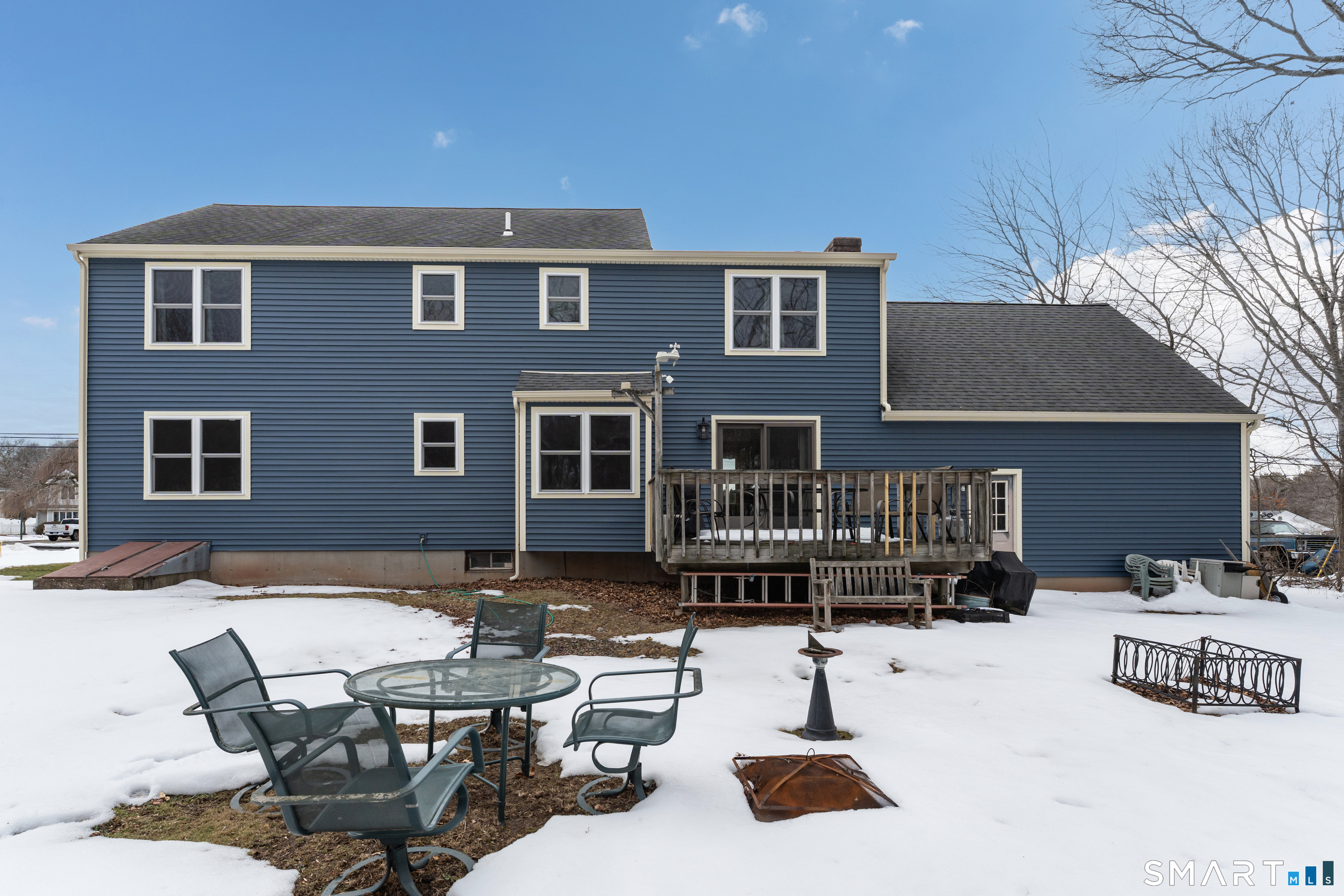 26 Pent Road Branford, CT 06405 - Photo 22 of 28 a backyard of a house with barbeque oven table and chairs