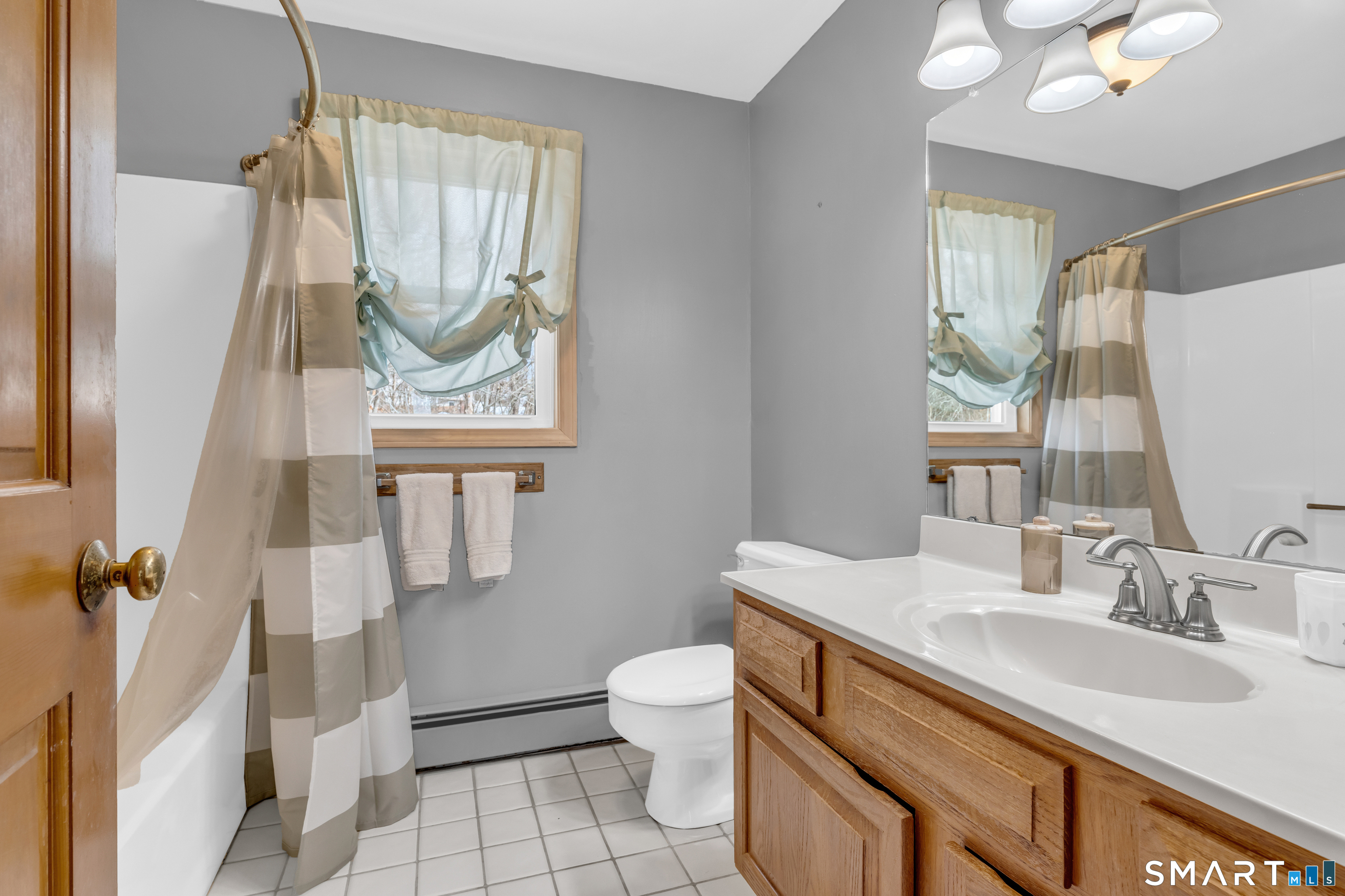 26 Pent Road Branford, CT 06405 - Photo 23 of 28 a bathroom with a sink toilet and shower