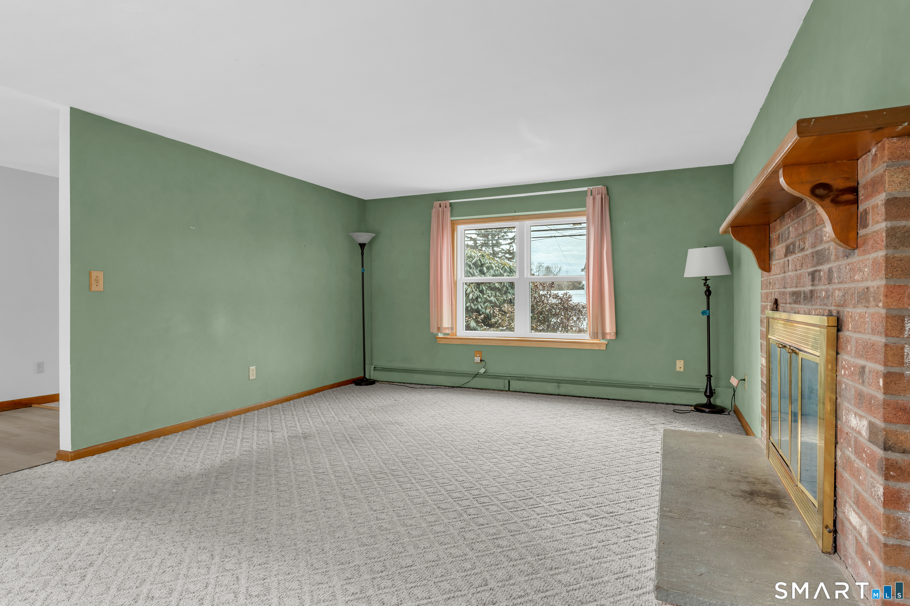 26 Pent Road Branford, CT 06405 - Photo 26 of 28 an empty room with windows and fireplace