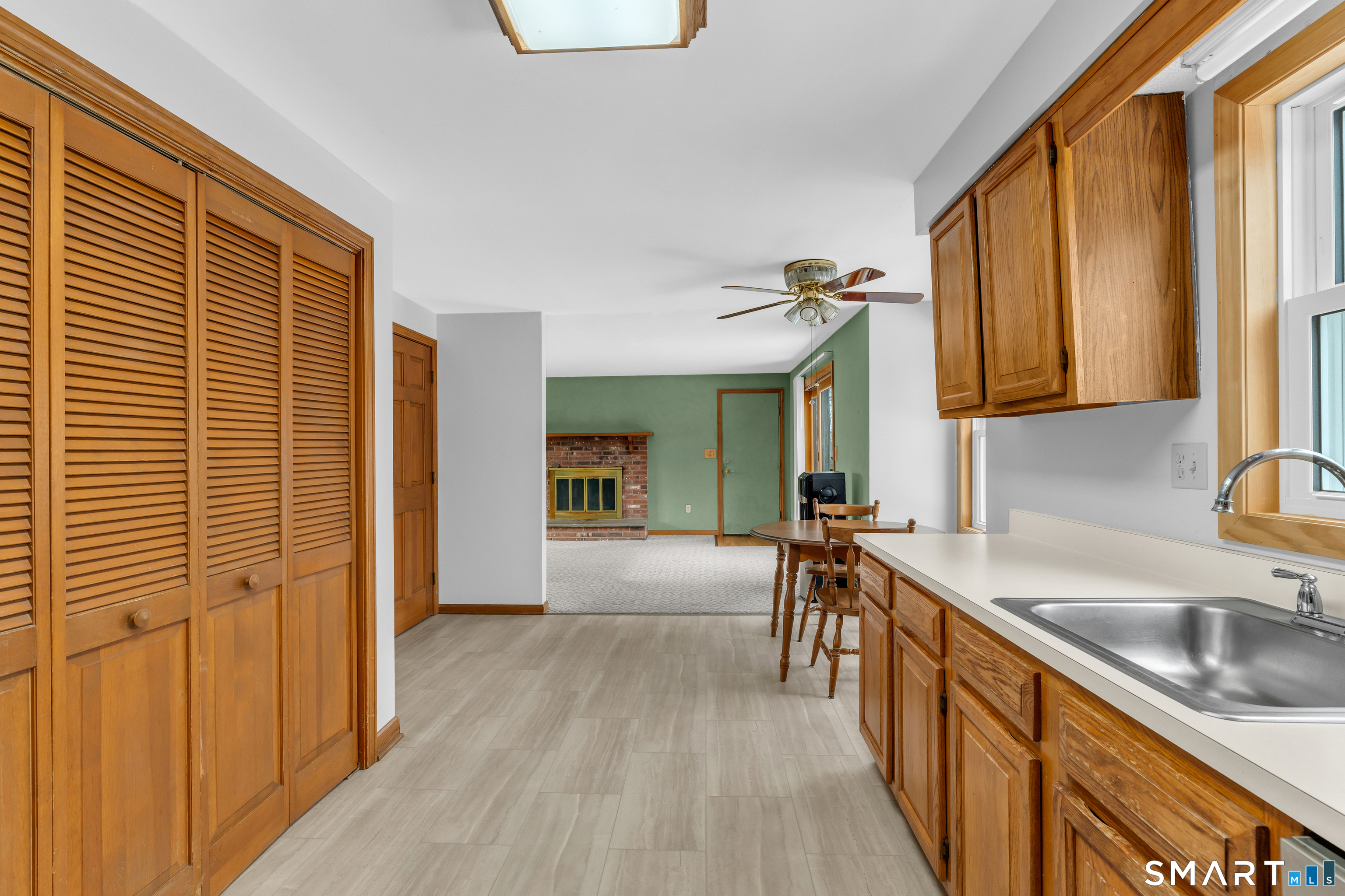 26 Pent Road Branford, CT 06405 - Photo 9 of 28 a view of a kitchen with a sink and cabinets