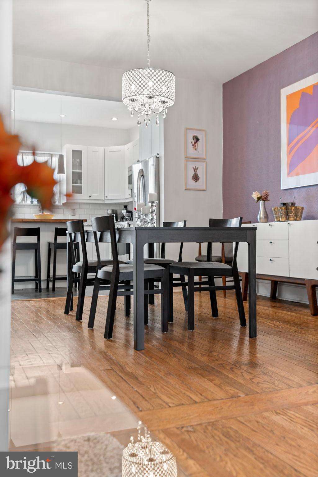 1728 South 13th Street Philadelphia, PA 19148 - Photo 14 of 31 a view of a dining room with furniture and chandelier