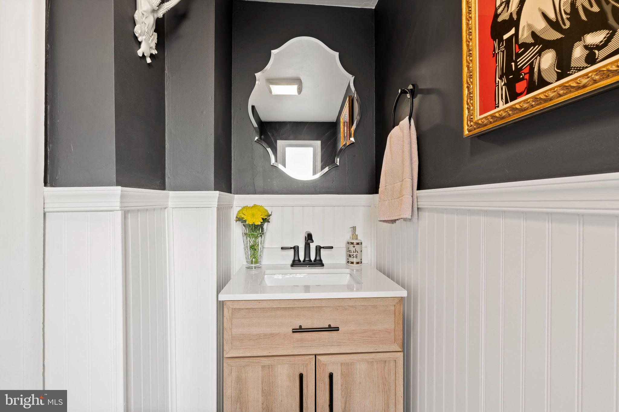 1728 South 13th Street Philadelphia, PA 19148 - Photo 15 of 31 a bathroom with a sink vanity and mirror