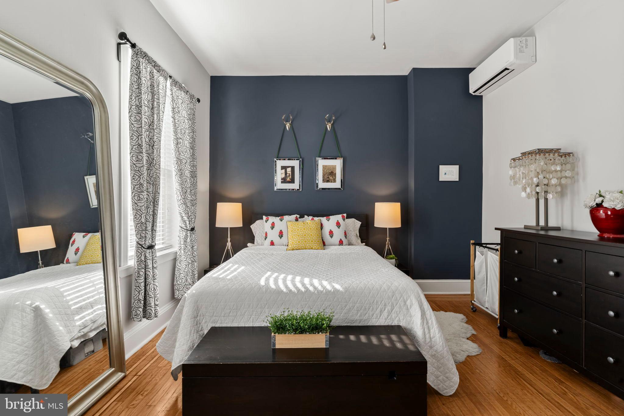 1728 South 13th Street Philadelphia, PA 19148 - Photo 20 of 31 a bedroom with a bed and a dresser