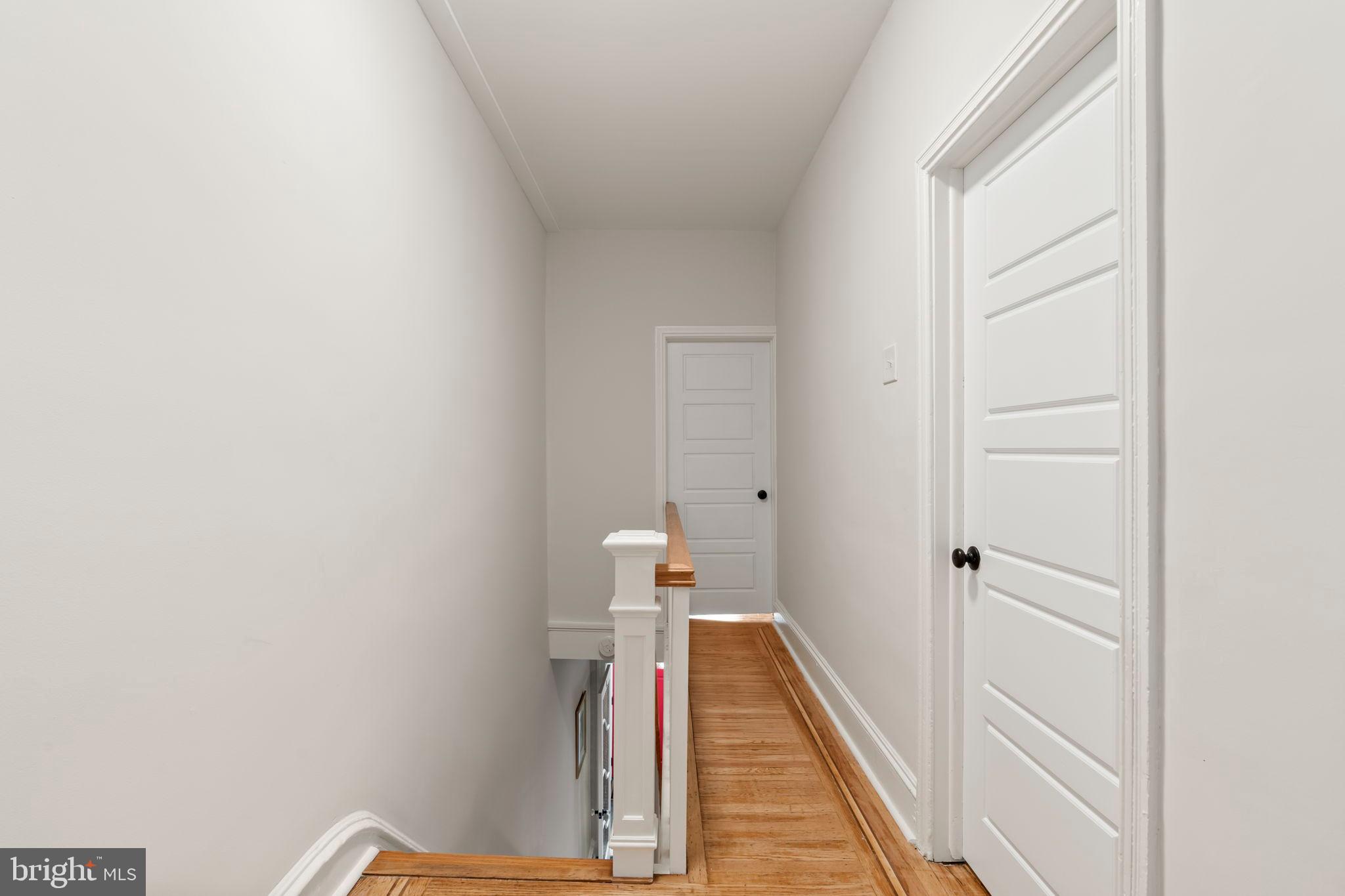 1728 South 13th Street Philadelphia, PA 19148 - Photo 22 of 31 a view of a hallway with wooden floor and staircase