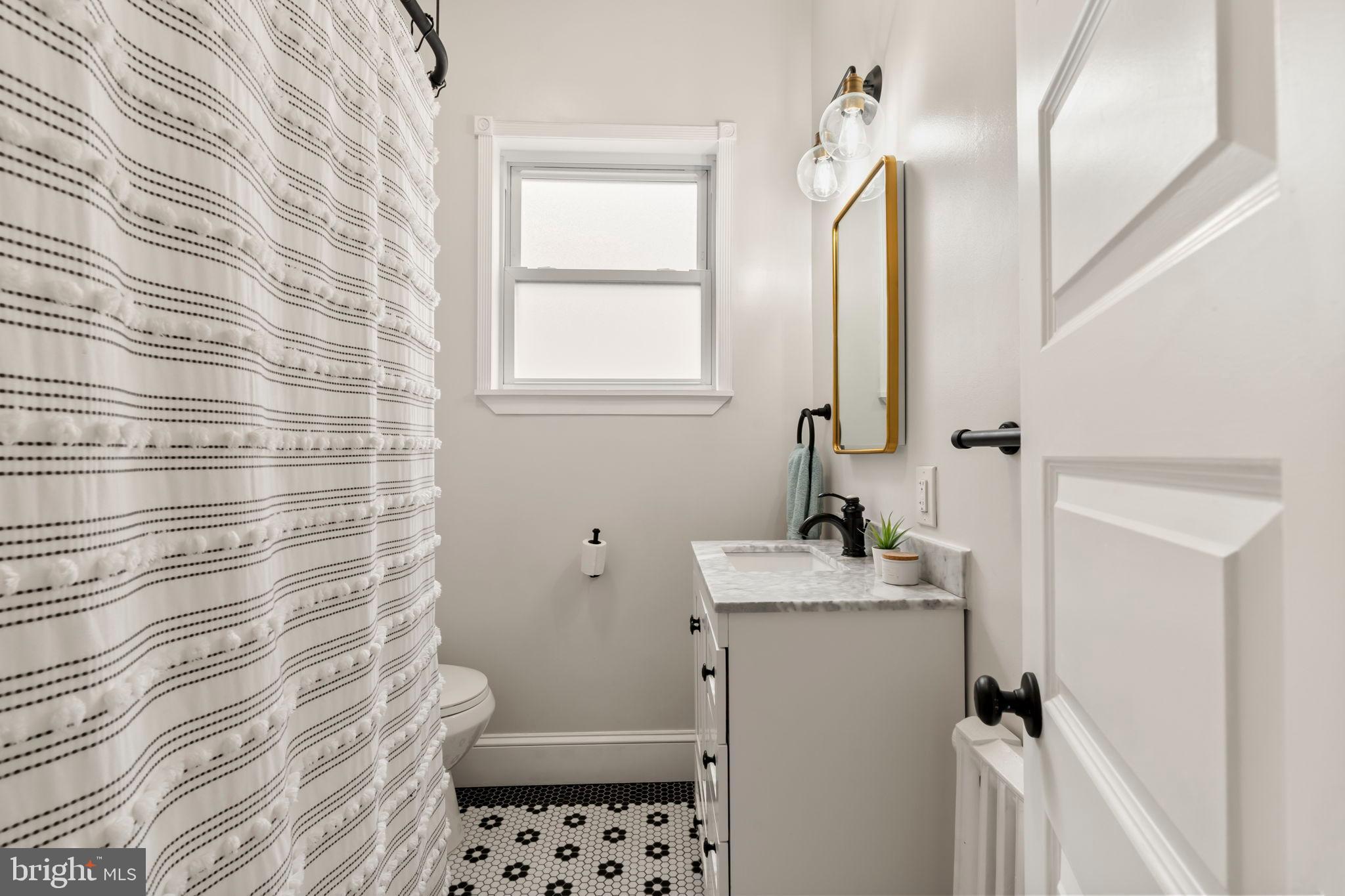1728 South 13th Street Philadelphia, PA 19148 - Photo 25 of 31 a bathroom with a sink toilet and shower