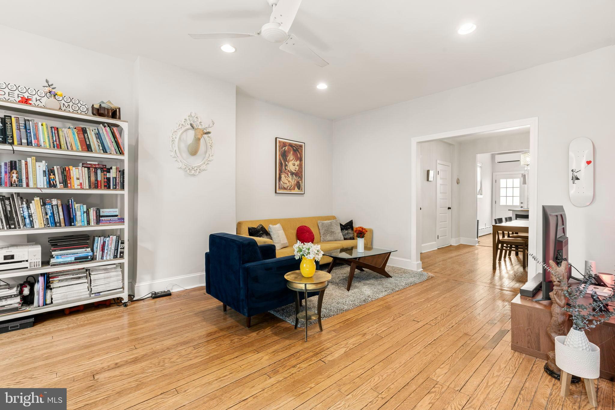 1728 South 13th Street Philadelphia, PA 19148 - Photo 8 of 31 a living room with furniture and a book shelf