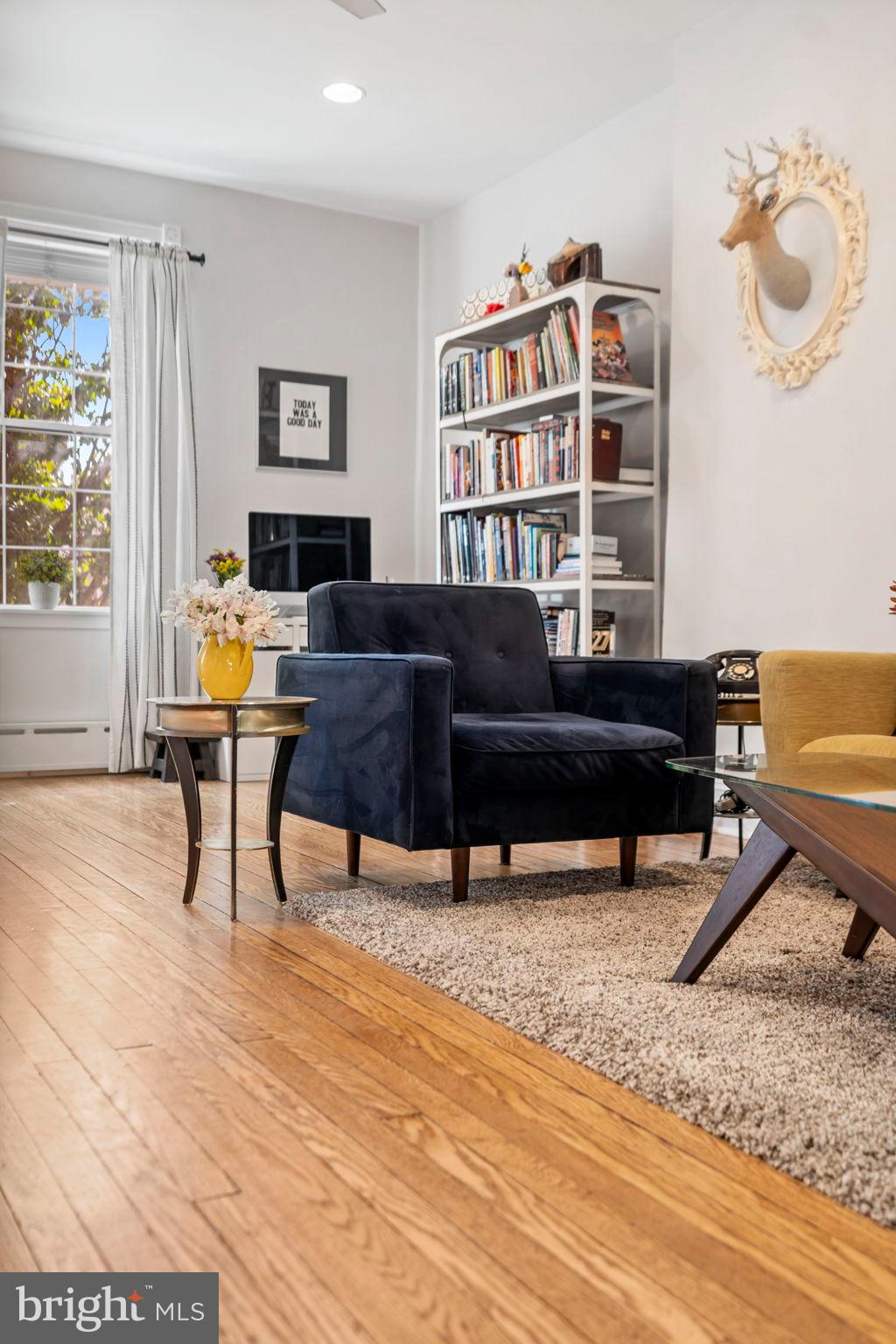 1728 South 13th Street Philadelphia, PA 19148 - Photo 9 of 31 a living room with furniture and a book shelf