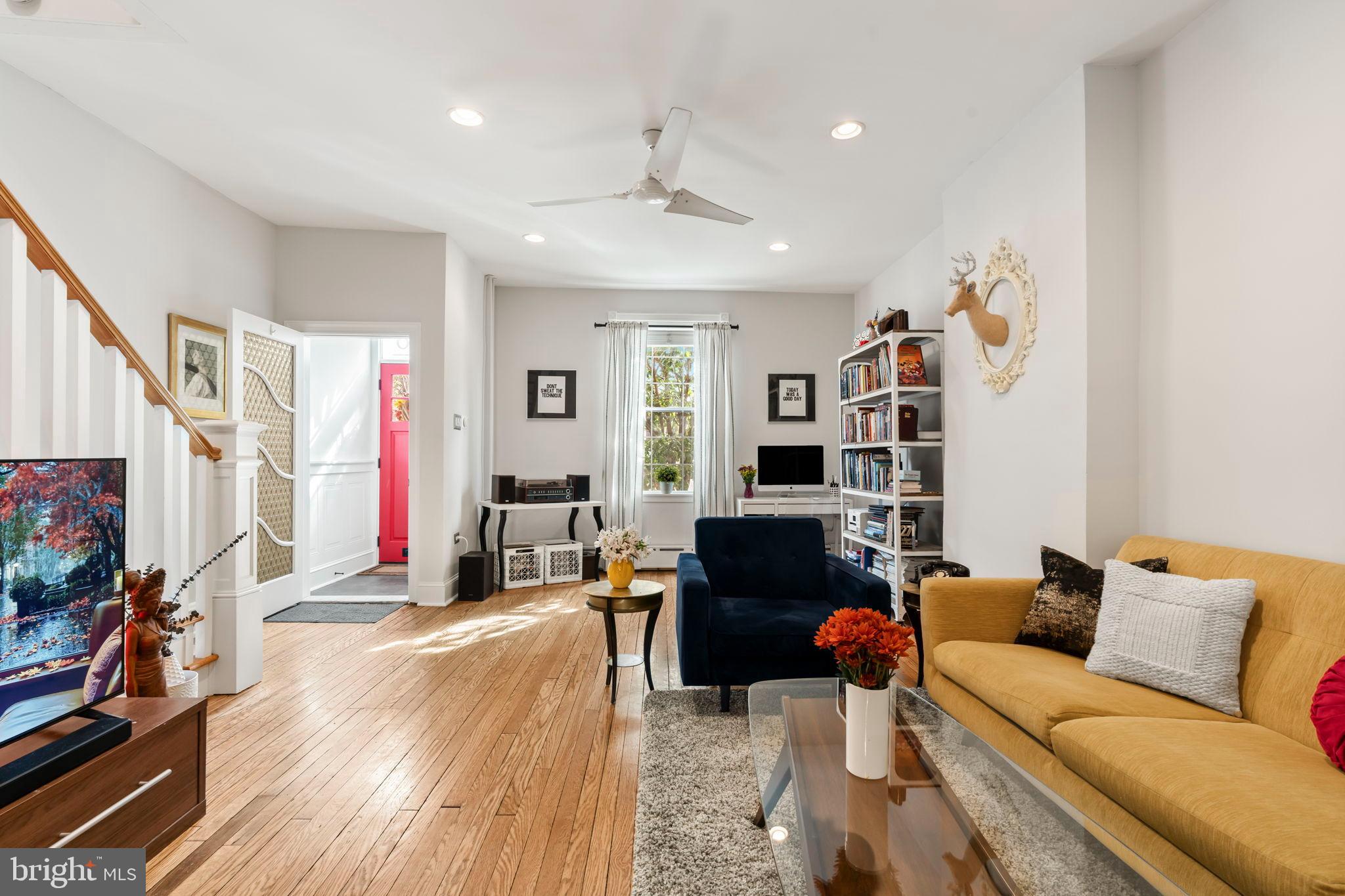 1728 South 13th Street Philadelphia, PA 19148 - Photo 10 of 31 a living room with furniture and a flat screen tv