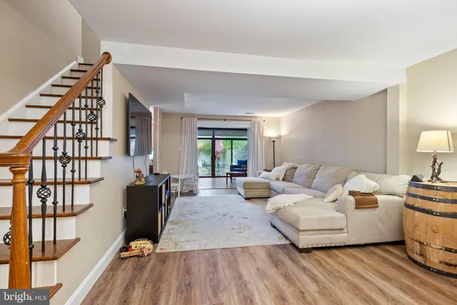 a living room with furniture fireplace and rug
