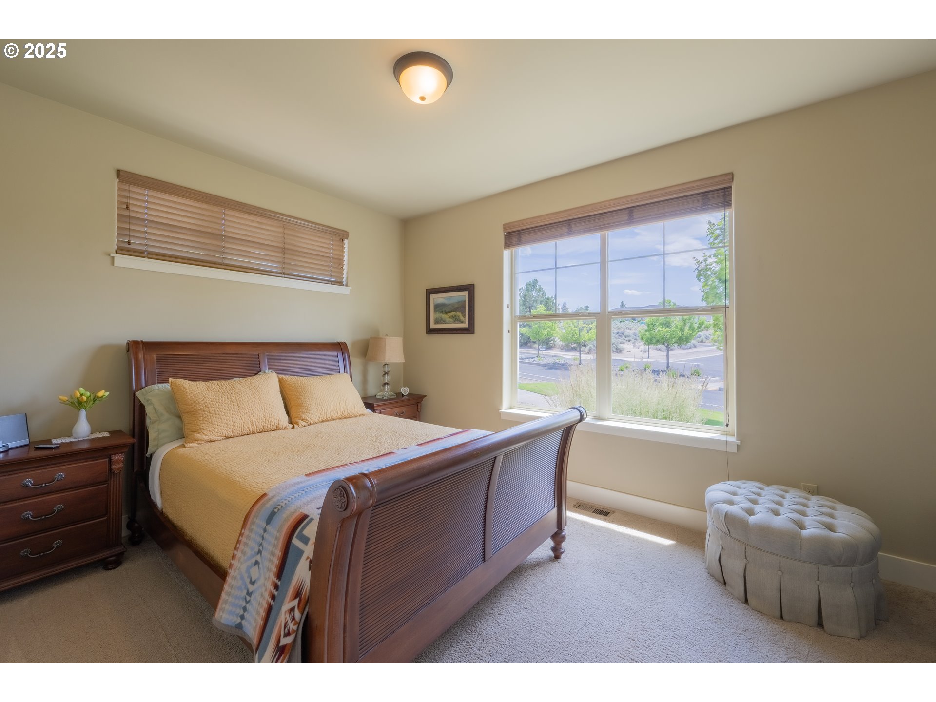 1202 Southeast Yarrow Avenue Madras, OR 97741 - Photo 15 of 16 a bedroom with a bed and a window