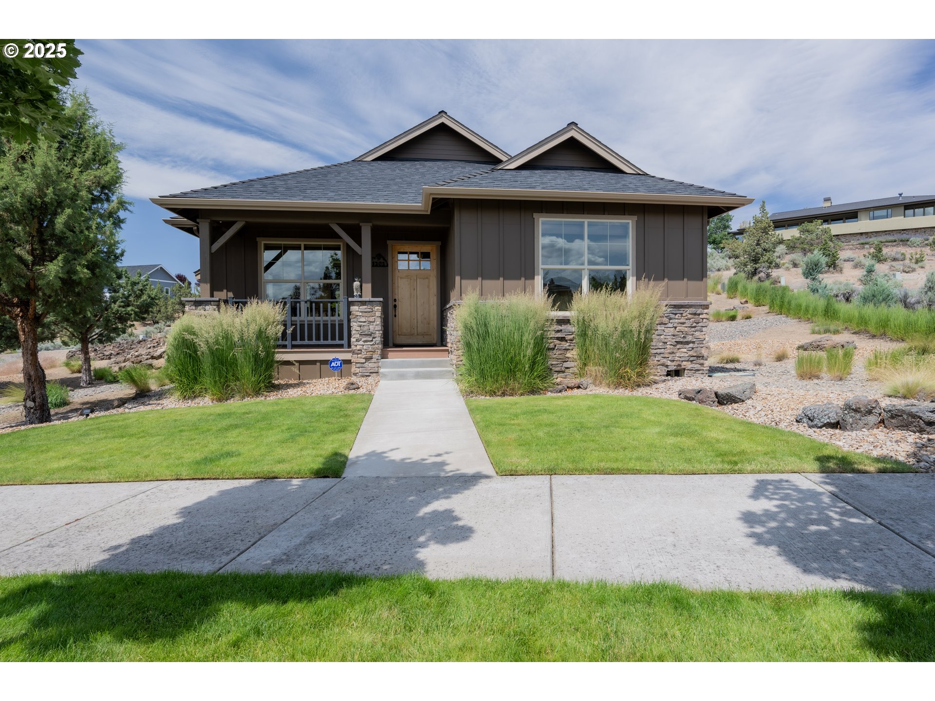 1202 Southeast Yarrow Avenue Madras, OR 97741 - Photo 10 of 16 a front view of a house with garden
