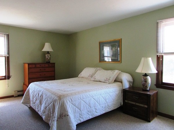 9 Sycamore Drive Rutland, MA 01543 - Photo 13 of 20 a bedroom with a bed and a lamp