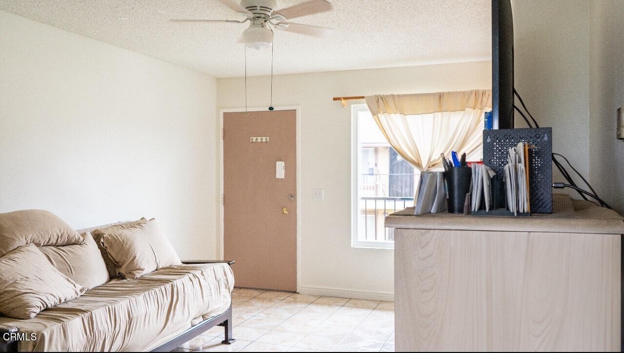 1920 North H Street, Unit 235 Oxnard, CA 93036 - Photo 3 of 13 a living room with furniture and a window