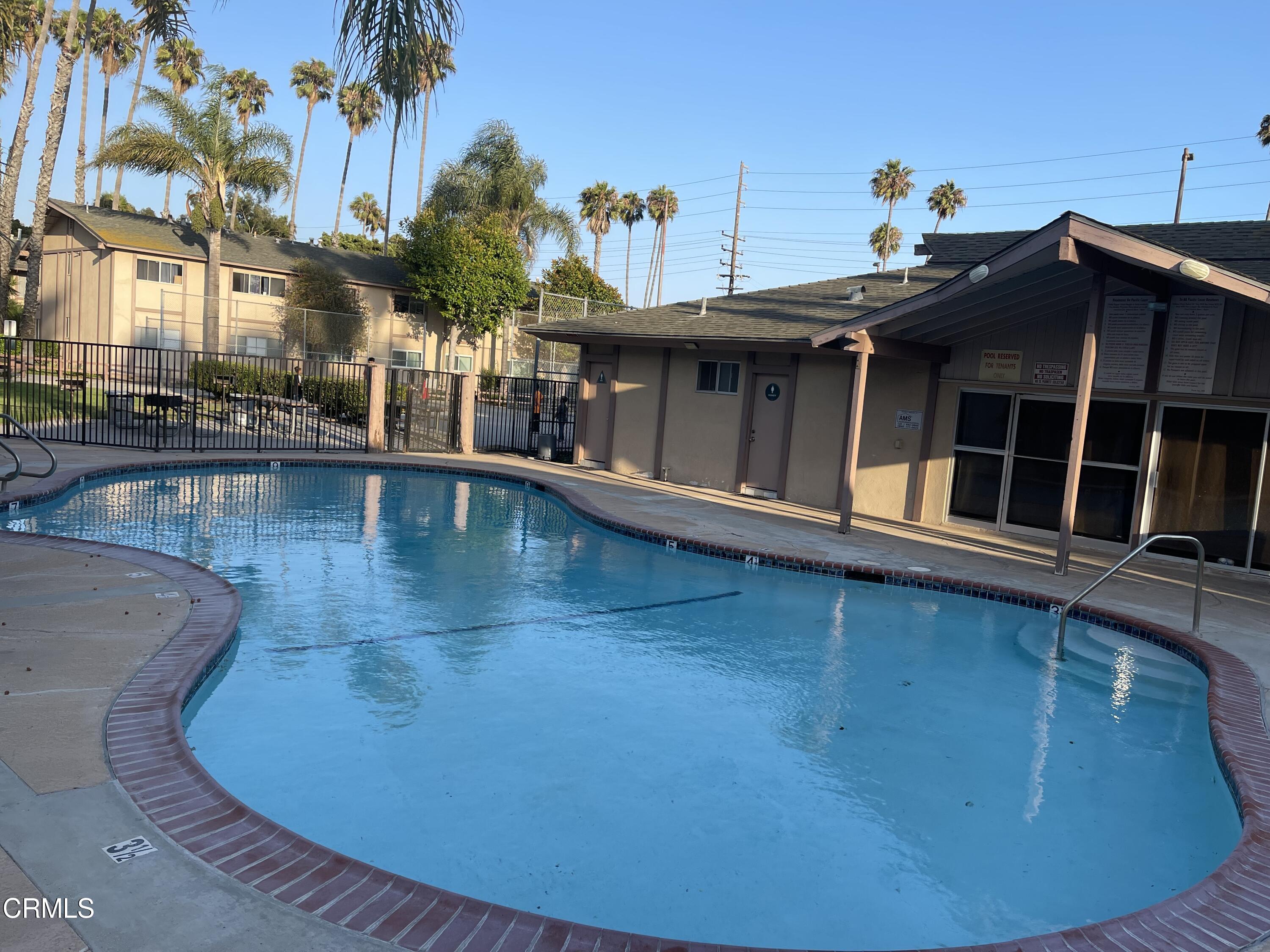 1920 North H Street, Unit 235 Oxnard, CA 93036 - Photo 10 of 13 a view of a swimming pool with a deck