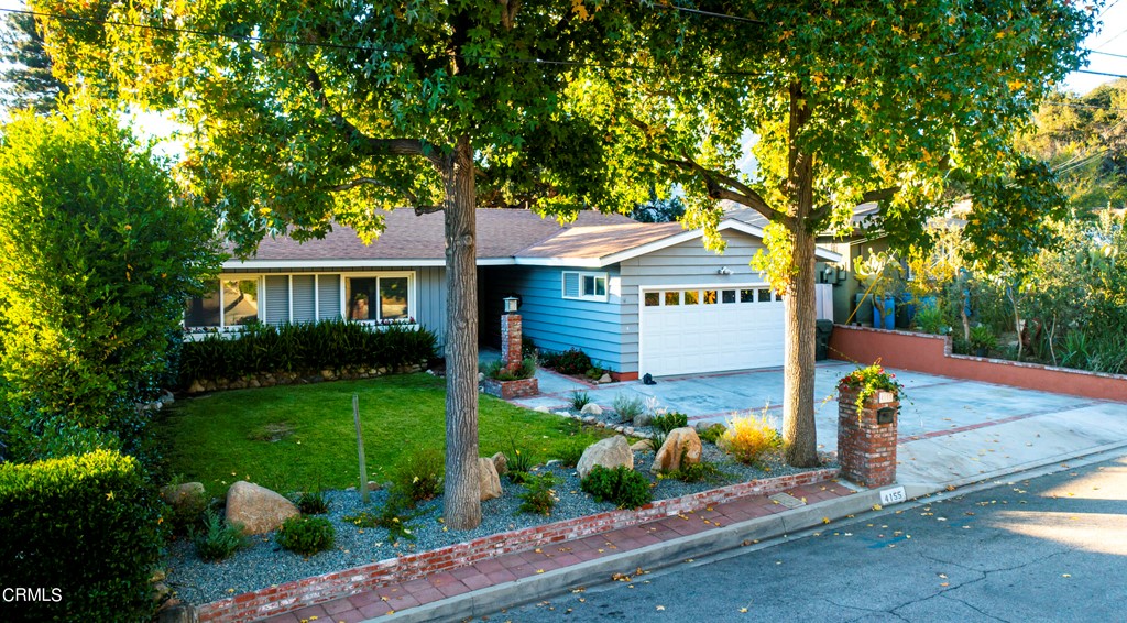 4155 Aralia Road Altadena, CA 91001 - Photo 1 of 28 a front view of a house with garden