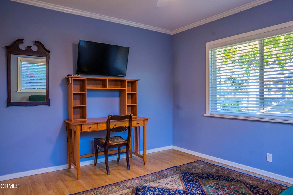 4155 Aralia Road Altadena, CA 91001 - Photo 11 of 28 a bedroom with a bed and a flat screen tv