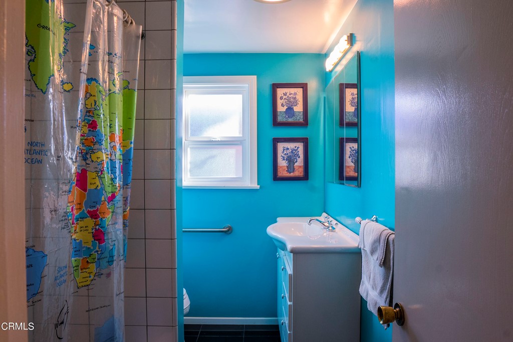 4155 Aralia Road Altadena, CA 91001 - Photo 12 of 28 a bathroom with a sink and a mirror