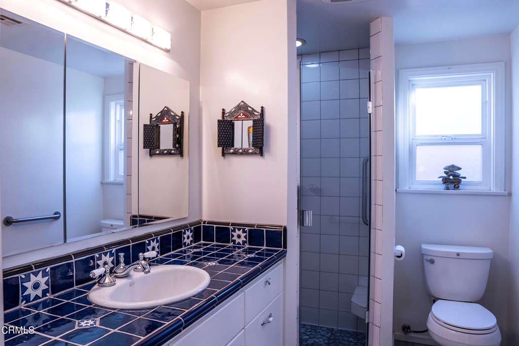 4155 Aralia Road Altadena, CA 91001 - Photo 13 of 28 a bathroom with a sink toilet and shower