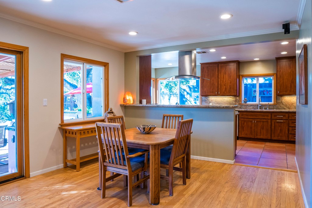 4155 Aralia Road Altadena, CA 91001 - Photo 4 of 28 a view of a dining room with furniture and a wooden floor