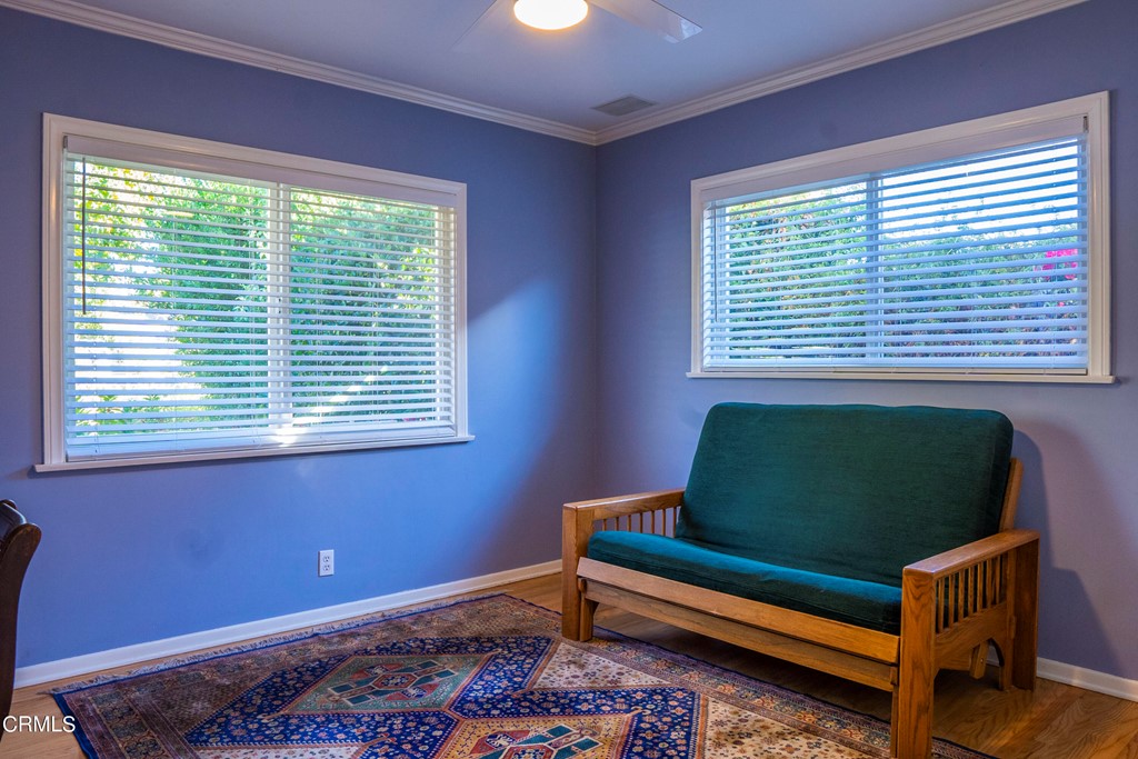 4155 Aralia Road Altadena, CA 91001 - Photo 10 of 28 a room with a window and a chair
