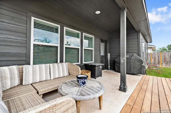 a outdoor living space with patio furniture and a garden