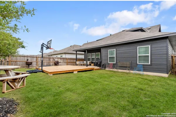 a view of a house with pool table and chairs