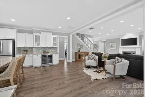a living room with fireplace furniture and a flat screen tv