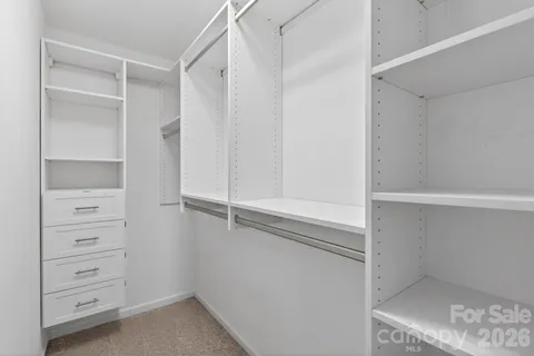 a view of an empty room with windows