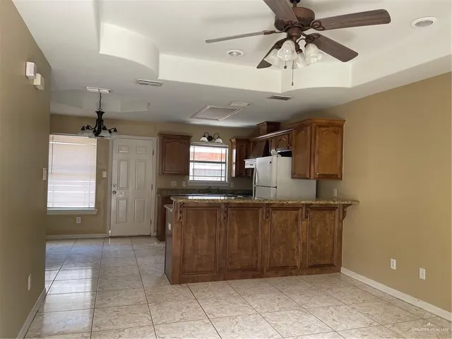 a kitchen with a cabinets and window