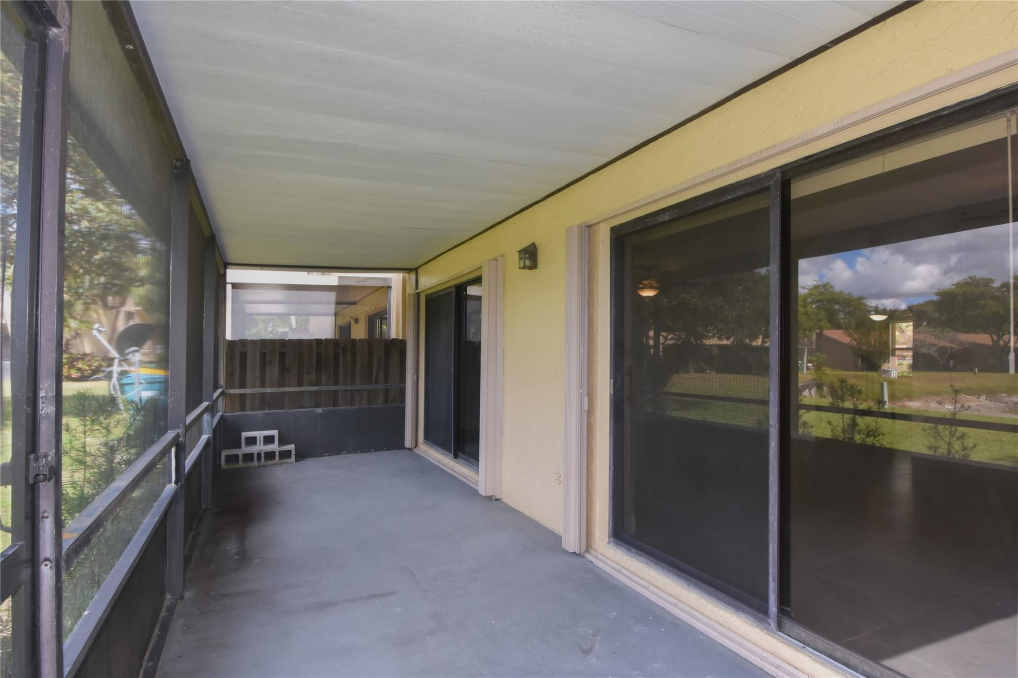 5467 Gate Lake Road, Unit 5467 Tamarac, FL 33319 - Photo 51 of 57 Screened Patio