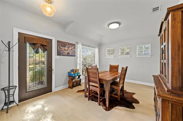 a view of a house with backyard and porch