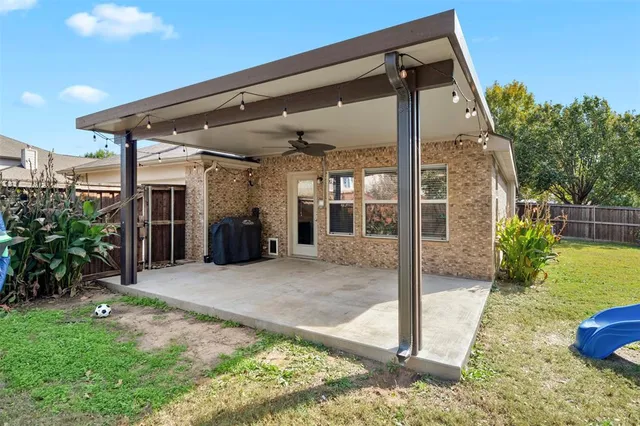 a house view with a backyard space