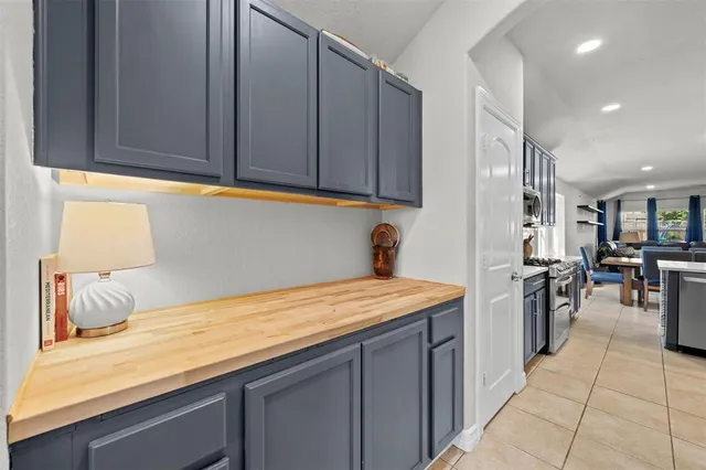 a view of a dining room with furniture and a large window