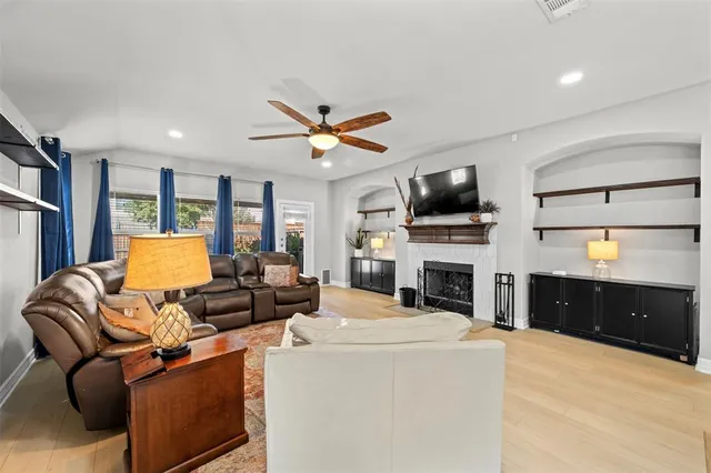 a living room with furniture and a fireplace