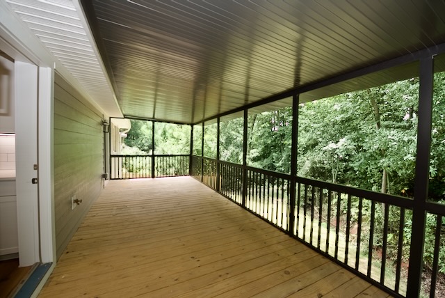 317 Pendleton Road Clemson, SC 29631 - Photo 19 of 36 A spacious covered deck extends into a lush, wooded backyard, providing a private outdoor retreat.