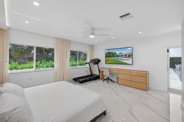 a bedroom with furniture and a window