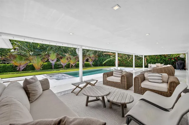 a balcony with furniture and garden view
