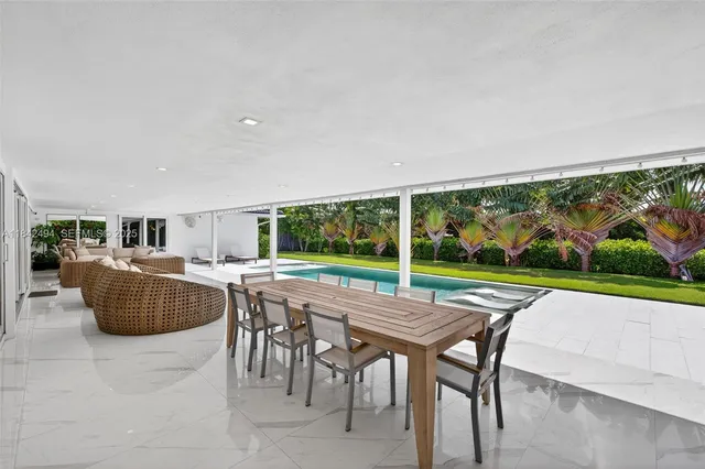 a patio with table and chairs